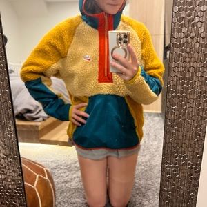 It’s a brand new Nike fleece pull over with zipper in front. With a hood